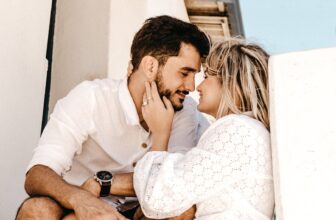 A couple sitting together in a cozy setting, engaged in a deep and open conversation, conveying warmth and connection.