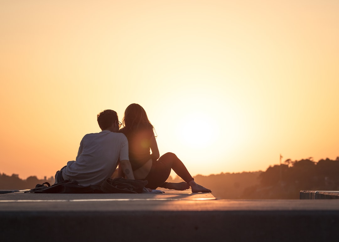 A couple enjoying a cozy moment together, perhaps sharing a meal or engaging in a fun activity at home.
